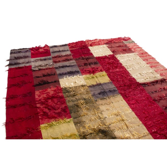 This vintage contemporary Tulu geometric from Rug & Kilim is ripe with immortal, rich color and tasteful repetition. The...