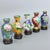 Presenting a magnificent set of five miniature Chinese cloisonné vases, exquisitely handcrafted with fine wirework and...