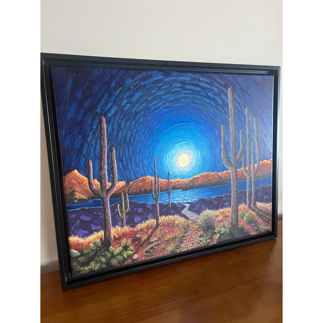 Original 16” × 20” oil painting featuring a dramatic moonlit desert landscape. Tall saguaro cacti rise against a richly...