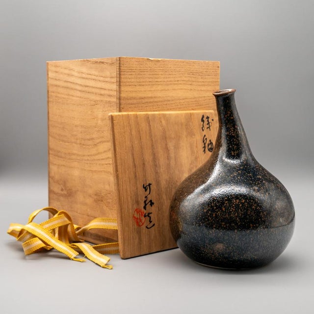 A characterful Japanese vase attributed to Miura Chikken, created in Kyoto in the mid-20th century. The piece follows a...
