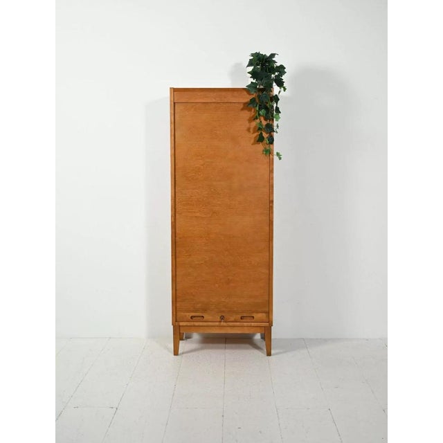 Restored single rolling shutter filing cabinet in solid elm wood, complete with all its original interior drawers. The...