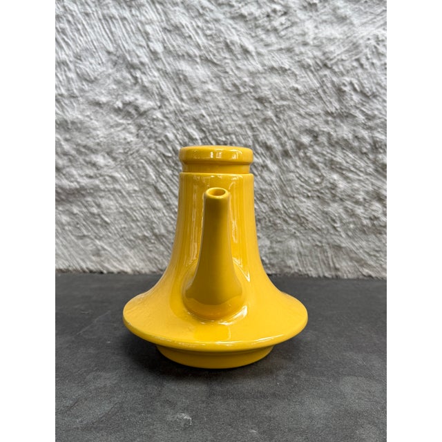 Bright yellow glaze teapot design by Pompeii Pianezzola for Zanolli & Sebelli, Italy. The original manufacturer’s label is...