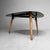 Vintage wooden coffee table, probably originating from Belgium. The table features an organically shaped top with soft,...