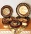 This vintage artisan-crafted red clay stoneware dinnerware service for four brings an earthy, hand-thrown rustic elegance...