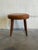Featuring a cushioned circular top elevated by tapered legs, this stool offers a minimal organic profile. Its clean form...