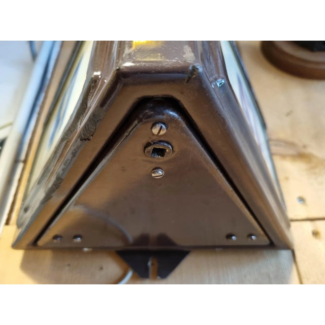 Street lamps indicating building numbers in Paris. Three models in brown enameled sheet metal and three painted black....