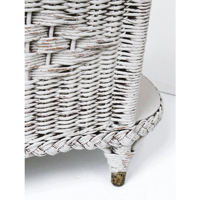 Early 20th Century French painted magazine rack with handle. We love it's old world charm and sturdy woven wicker & wood...