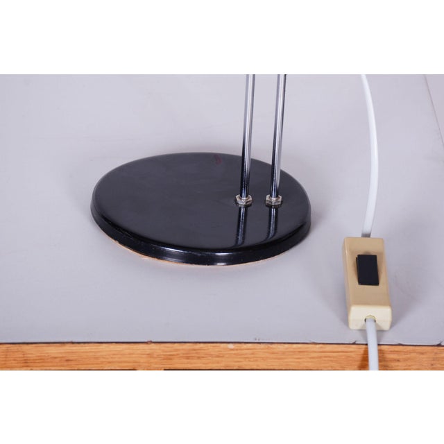 Designer: Stanislav Indra Maker: Combi Lux This distinctive adjustable desk lamp originating from the 1970s from...