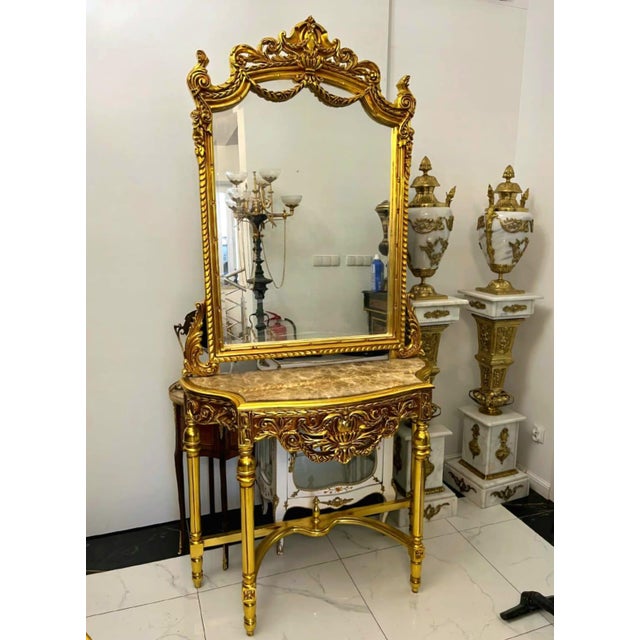 Elevate your home with timeless European elegance through this breathtaking French-style console table and matching mirror...