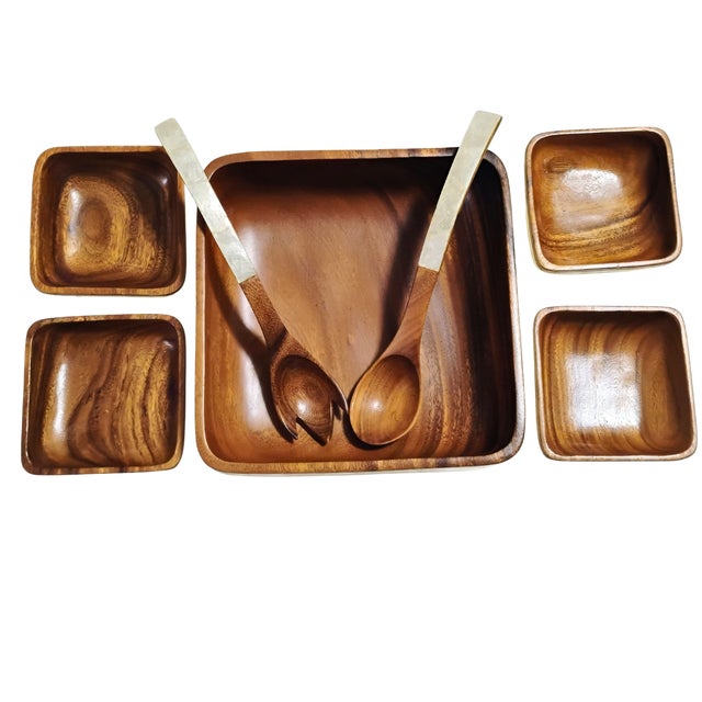 This exquisite 7-piece mid-century modern salad set features hand-carved wood beautifully accented with a shimmering,...