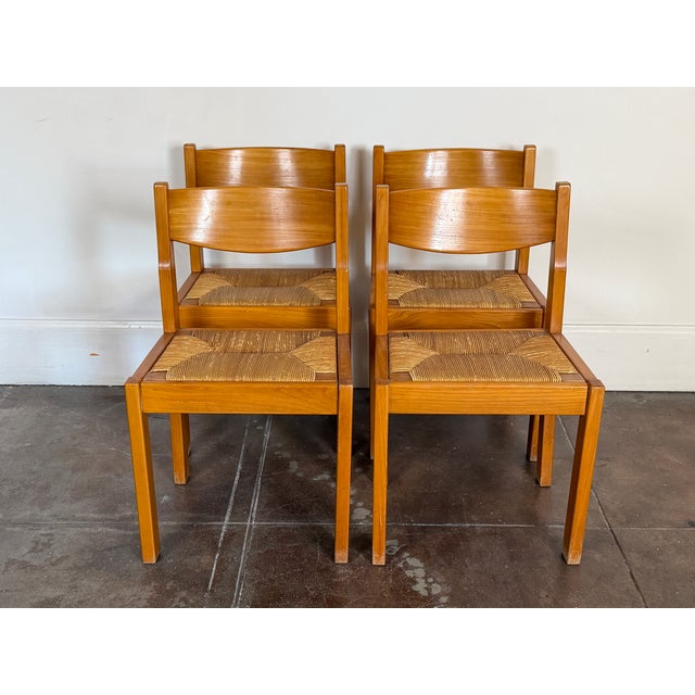 1970s set of four Maison Regain solid elm and rush dining chairs in good vintage condition. Unsigned. Dimensions 20” x 17”...