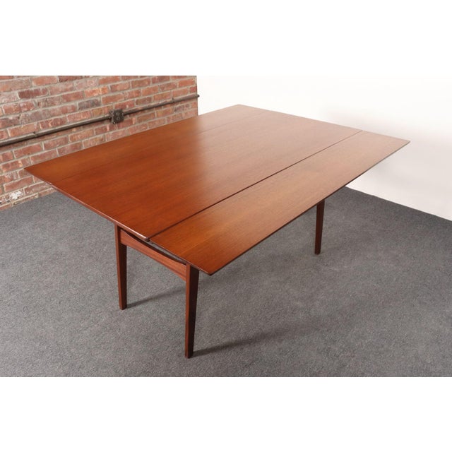 Danish Modern solid teak "elevator" coffee table (ca. 1960s). Easy transition converting from low coffee table to higher...