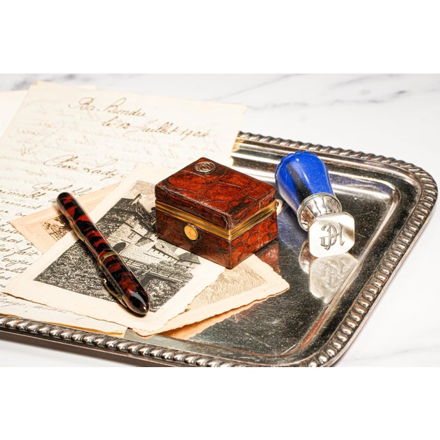 A rare and distinguished find, this antique leather stamp box, dating to circa 1910, embodies the elegance of a bygone...
