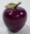 Vintage purple marble paper weight in the shape of an apple with brass stem to top. Age wear. Patina to brass.