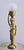 A striking vintage African brass figural table lamp featuring a graceful standing female figure balancing a bowl-form...