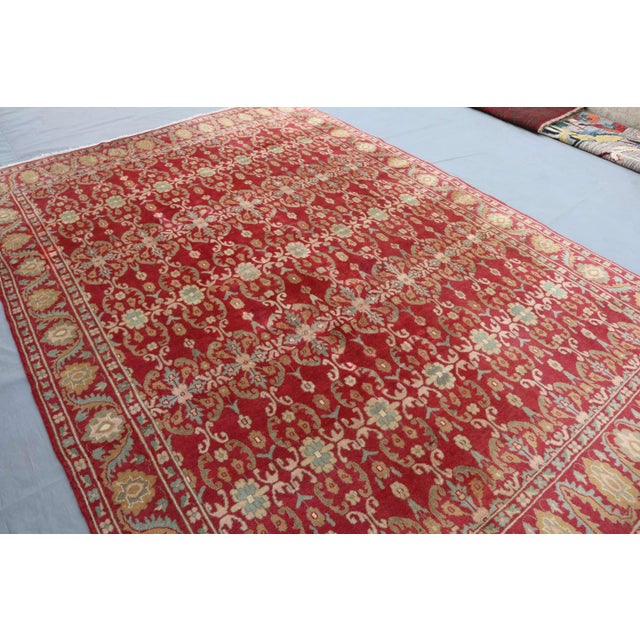 This vintage Afghan rug, hand-knotted in the 1980s in Herat City, showcases the exquisite Waziri design. Made from 100%...