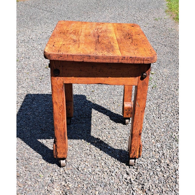 Antique Industrial Rolling Table Kitchen Island. It is 23" deep x 30" wide x 32" high with metal wheels. Table has been...