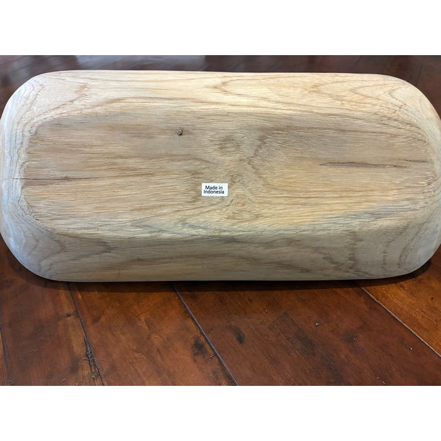 This is a carrying tray known England a trug. Usually used in the garden to carry tools or cut flowers. It has only been...