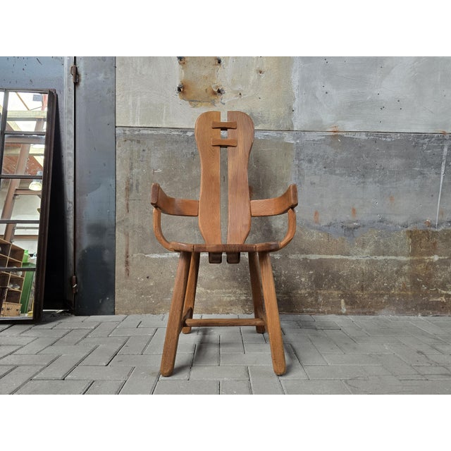 This single robust chair is made in Belgium by the renowned 'de Puydt' company during the 1970's. It is completely made of...
