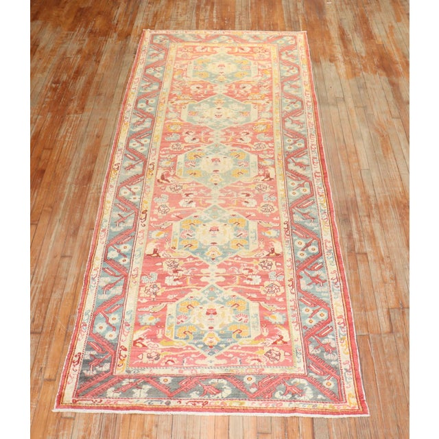 An early 20th Century Turkish Ghiordes Wide size floral runner