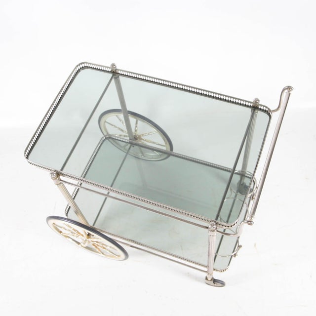 Stunning silver-plated metal serving cart with two tinted glass shelves, dating from the 1970s. A quality piece in very...