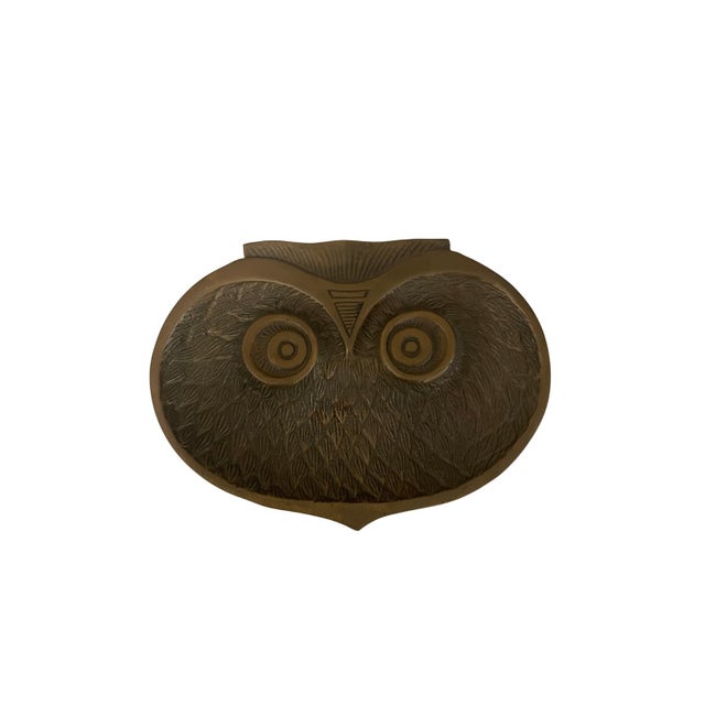A vintage trinket tray, catch all of an owl’s face, this piece features intricate feather etching and raised circular...