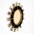A striking Spanish Modernist sunburst mirror dating to circa 1990, combining giltwood, black glass, brass and antiqued...