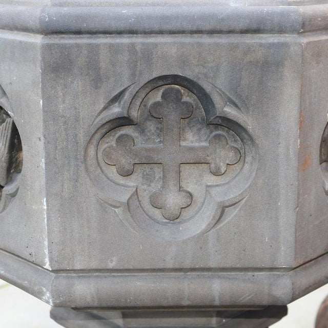 An exceptional 19th-century Gothic Revival baptismal font, meticulously crafted from hardstone, brass, oak, and wrought...