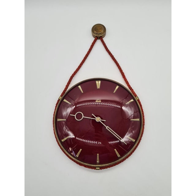 An original upg halle wall clock manufactured in the former gdr, dating from the 1960s/1970s. a highly decorative model...