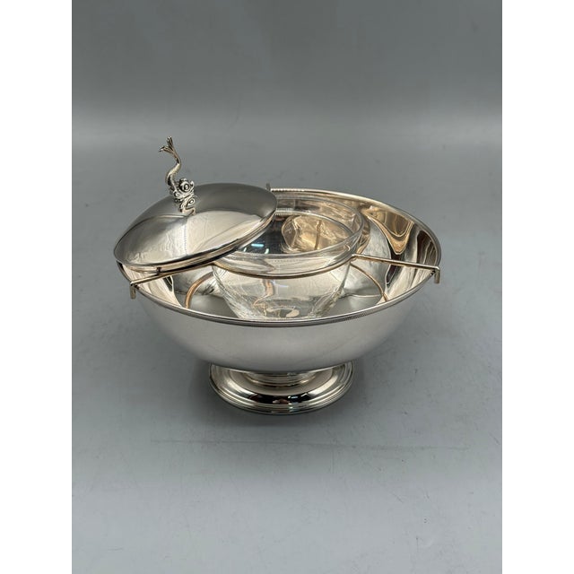 A sculptural caviar server hand-finished by master silversmiths in Istanbul's Grand Bazaar. Silver plated brass with an...