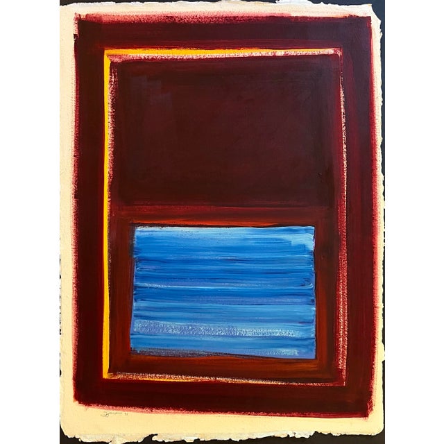 Oil painting on deckle edge artist’s paper of a central color field of deep burgundy and blue surrounded by a thin gold...