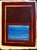 Oil painting on deckle edge artist’s paper of a central color field of deep burgundy and blue surrounded by a thin gold...