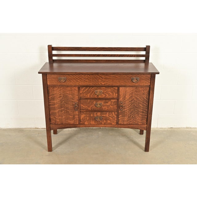 A rare and exceptional antique Mission or Arts & Crafts period sideboard, buffet server, or bar cabinet with plate rack By...