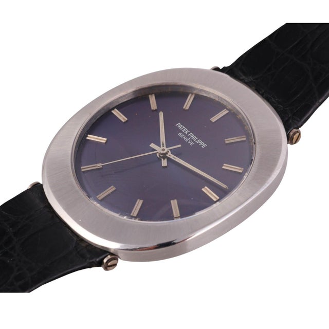 Unique Patek Philippe automatic watch in stainless steel featuring a cushion-shaped case measuring 35 x 40mm with metallic...