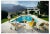 Slim Aarons, Catch Up by the Pool, 1970s, Estate Stamped Photographic Print For Sale