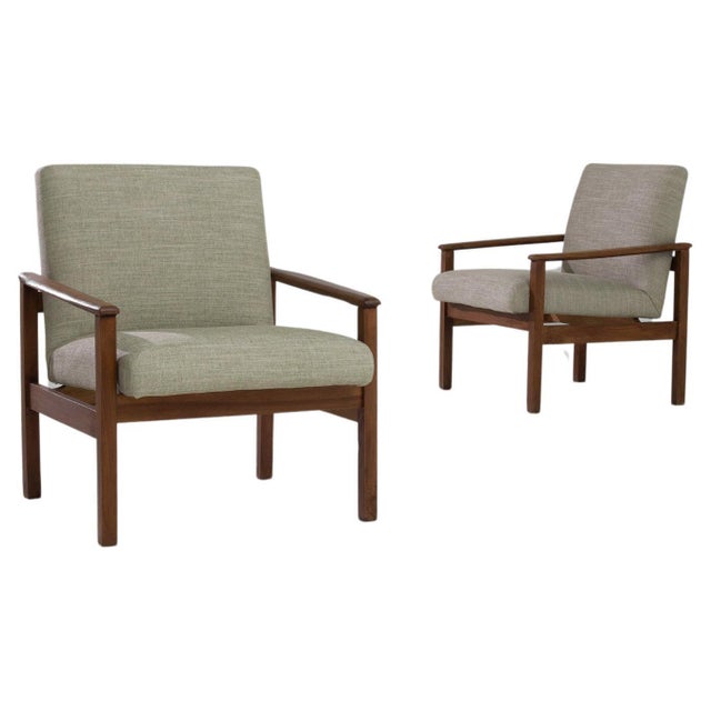 This 1970s Danish pair of wooden armchairs encapsulates the essence of Scandinavian design - minimalist, functional, and...