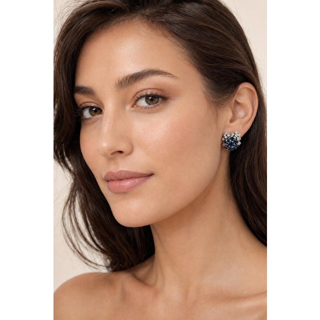 A pair of Danish floral earrings by Frantz Hingelberg, crafted in 14K white gold and set with approximately 3.50 carats of...