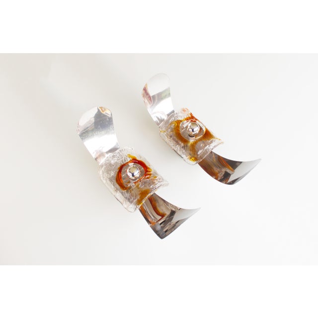 Set of two metal & glass sconces by AV Mazzega. Both in very good condition and electrical wires updated to modern...