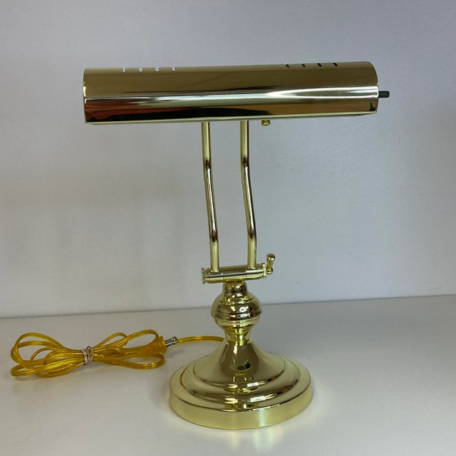 This style of lamp is referred to as a Piano Lamp because it would sit on the piano above the sheet music giving it light...