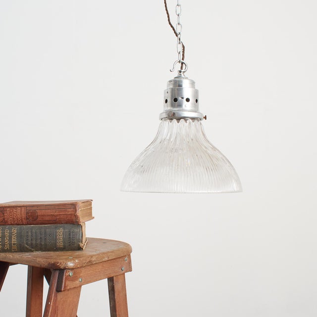 A vintage bell shaped holophane glass prismatic pendant light shade which looks great both lit and unlit. The light has...