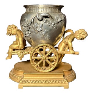 Late 19th Century Gilt And Silvered Bronze Table Ornament With Putti And Urn For Sale
