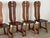 Dining chair constructed in solid oak, produced in Belgium during the 1960s. Each chair has a tall, split backrest carved...