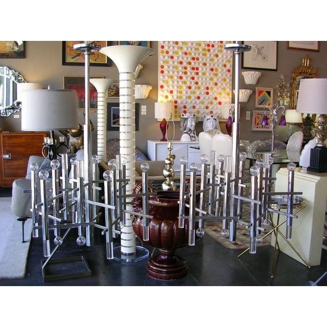 A vintage Sciolari chandelier in chrome with Lucite accents. chandelier holds 15 lights.