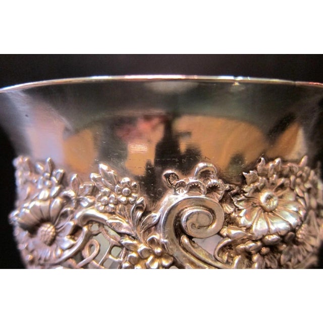 This vintage early 1900’s American Brilliant cut crystal vase is beautifully accented with a stunning sterling silver neck...