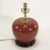 Elevate your space with this elegant vintage ceramic table lamp featuring a rich oxblood red glaze and timeless rounded...
