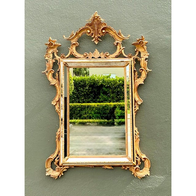 This vintage LaBarge mirror is a showpiece of Rococo-inspired carving, wrapped in a warm, lustrous gilt finish. A pierced,...
