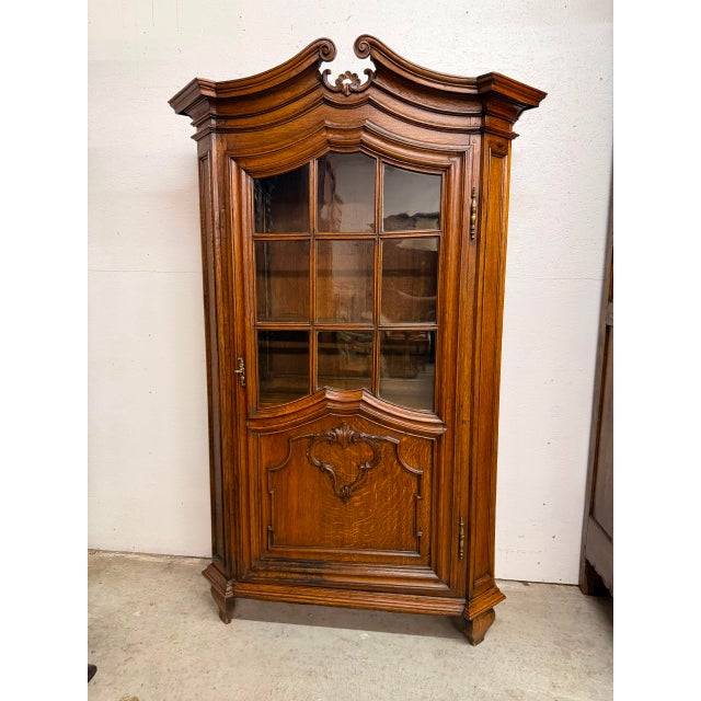 French Late 19th Century Louis XV Style oak bookcase, circa 1860, featuring a single glazed door with nine individual...