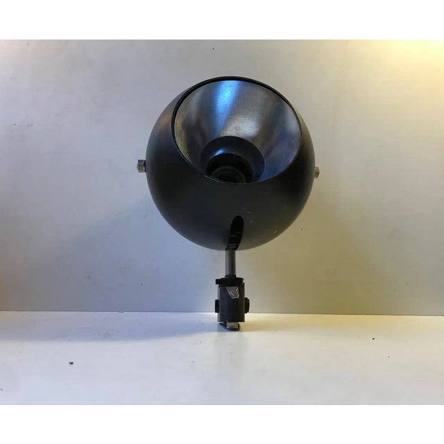A rare Verner Panton inspired wall or ceiling sconce. Fully adjustable and made from black powder coated steel and...
