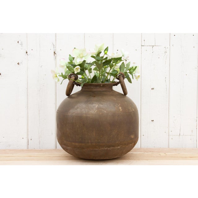 This gorgeous antique Indian brass planter with handles is a perfect addition to any space, combining a unique antique...