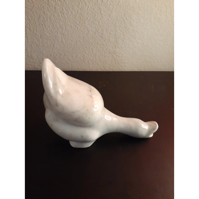 This is a Solid Marble 8" Laying Duck Figurine. Procured at auction BOX B